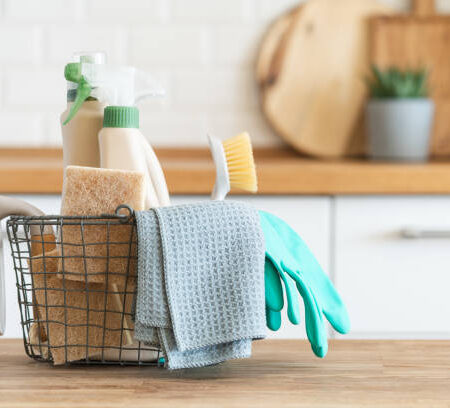 Modern kitchen interior in the background. House cleaning concept Modern kitchen interior in the background. House cleaning concept