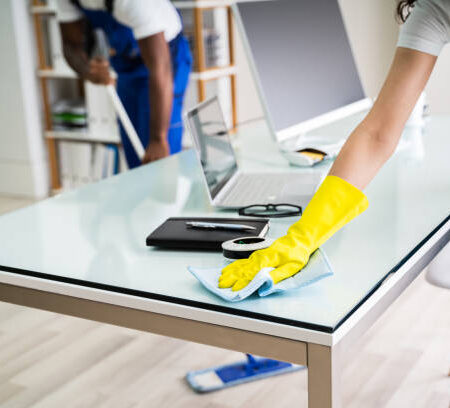 Young Male And Female Cleaners Cleaning Office Young Male And Female Cleaners Cleaning Office