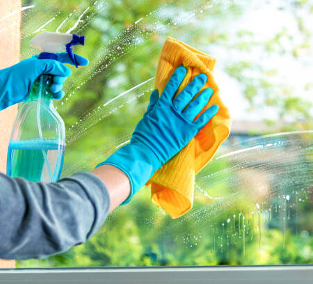 Cleaning window pane with detergent, spring cleaning concept Cleaning window pane with detergent, spring cleaning concept